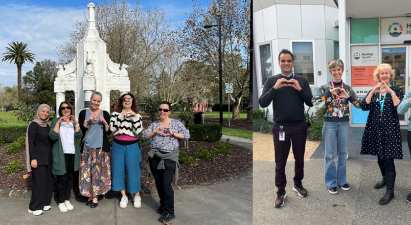 Two teams are standing outdoors making heart shapes with their hands